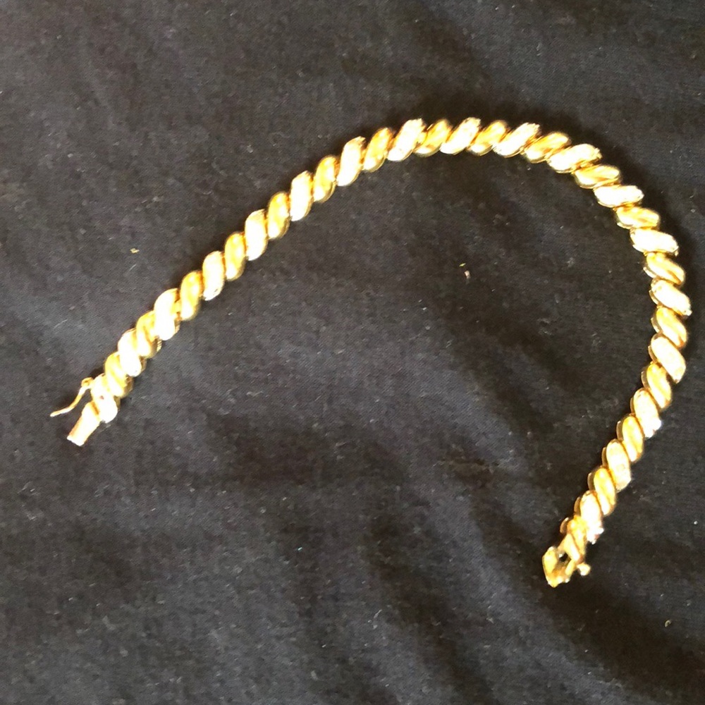 Gold tone and rhinestone bracelet.